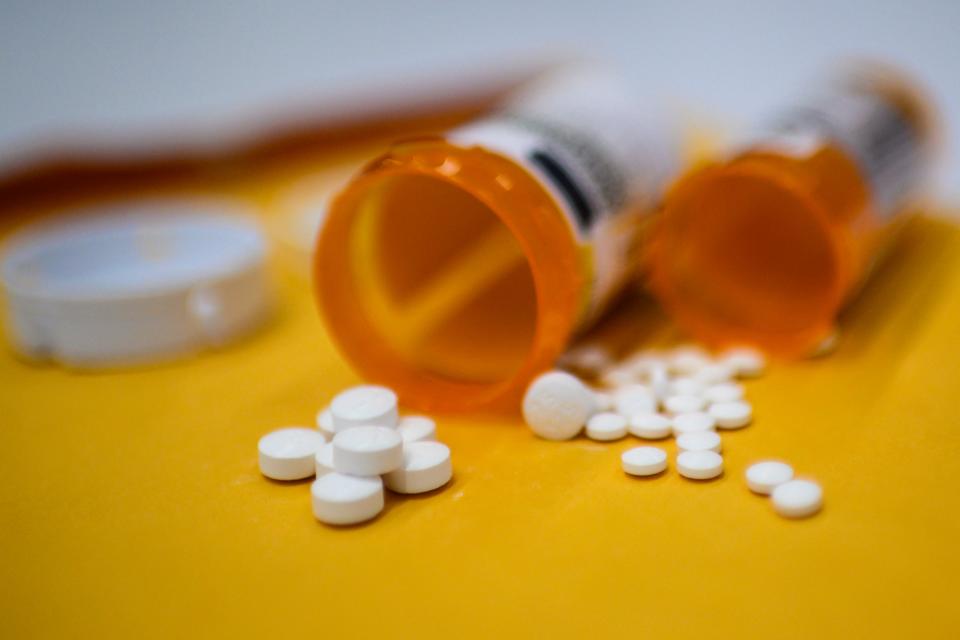 This illustration image shows tablets of opioid painkiller Oxycodone delivered on medical prescription taken on September 18, 2019 in Washington,DC. Millions of Americans sank into addiction after using potent opioid painkillers that the companies churned out and doctors freely prescribed over the past two decades. Well over 400,000 people died of opioid overdoses in that period, while the companies involved raked in billions of dollars in profits. And while the flood of prescription opioids into the black market has now been curtailed, addicts are turning to heroin and highly potent fentanyl to compensate, where the risk of overdose and death is even higher. (Photo by Eric BARADAT / AFP) (Photo by ERIC BARADAT/AFP via Getty Images)