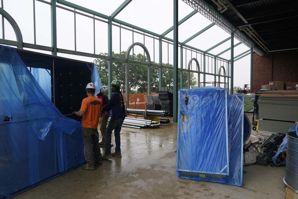 Construction continues in what will be an open air dining area in UBS Arena, the future home of the New York Islanders NHL hockey team, in Elmont, N.Y., Thursday, June 3, 2021. The building will have all the bells and whistles and be better accessible to Islanders fans than the recent temporary home in Brooklyn, and the hope is it will provide a strong home-ice advantage for decades to come. (AP Photo/Seth Wenig)