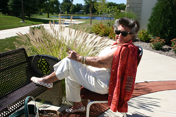 Shirley Meyer sits outside the building that bears her name – the La-Z-Boy Center, Meyer Theater – which is located on the campus of Monroe County Community College. Her $1 million gift in 2000 led to the construction of the facility, which opened in 2004.