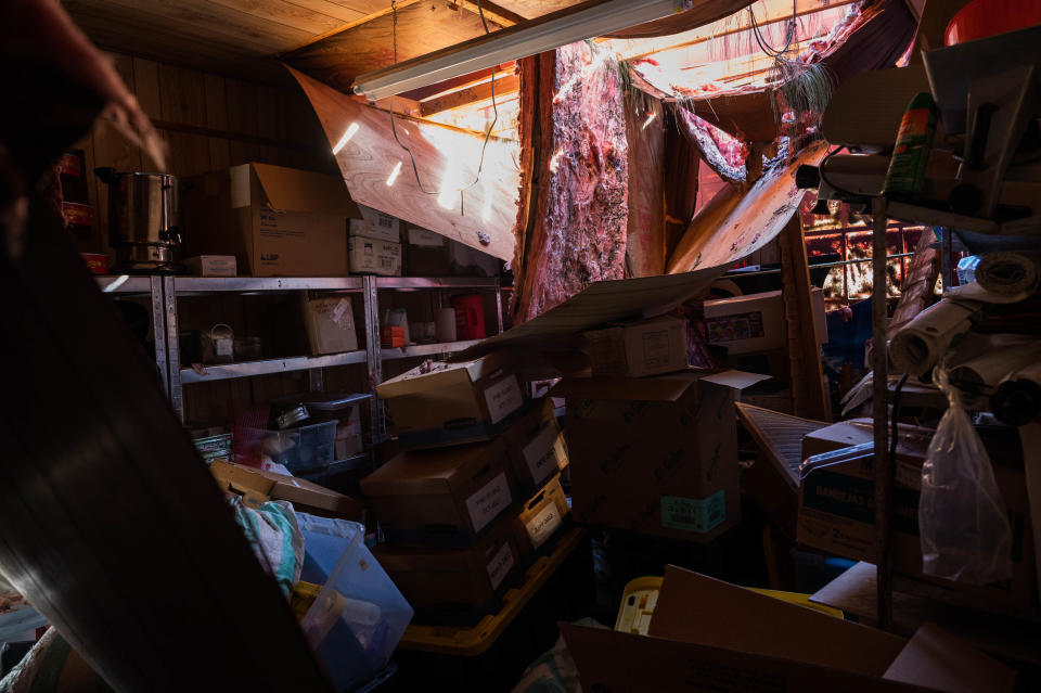 Broken pieces of roofing are seen in a store room at Bubba's Roadhouse & Saloon after Hurricane Ian passed through the region Wednesday afternoon in Cape Coral, FL., on Friday, September 30, 2022.