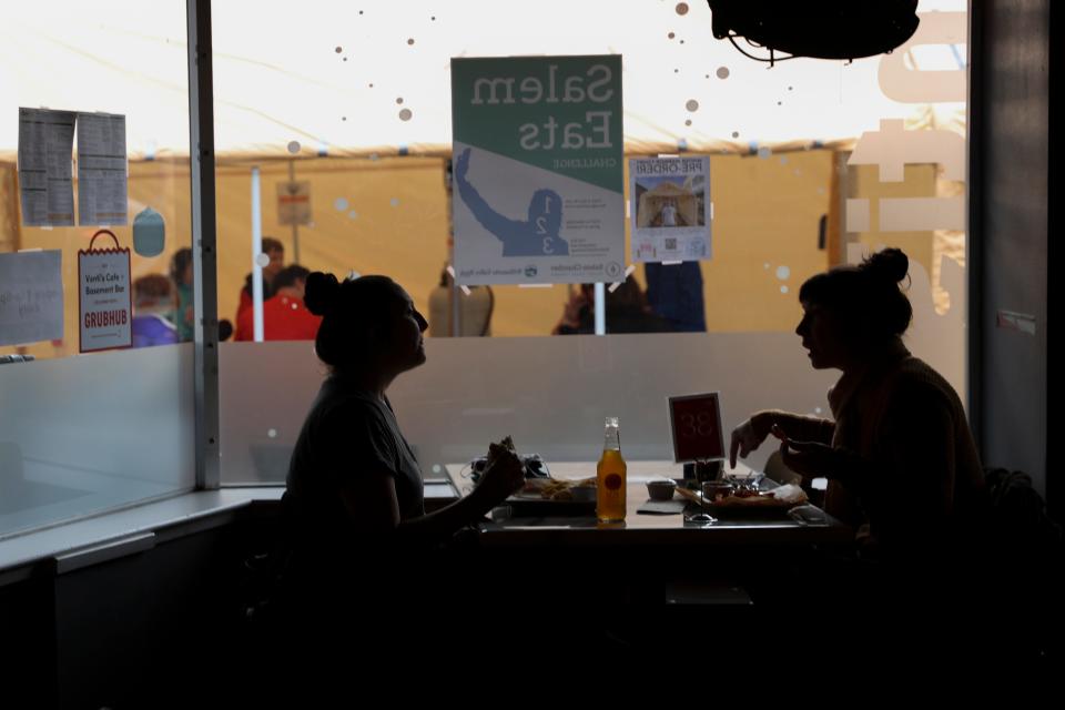 People eat lunch inside and outside on the first day restaurants are allowing dine-in, in Salem on Friday, Feb. 26, 2021.