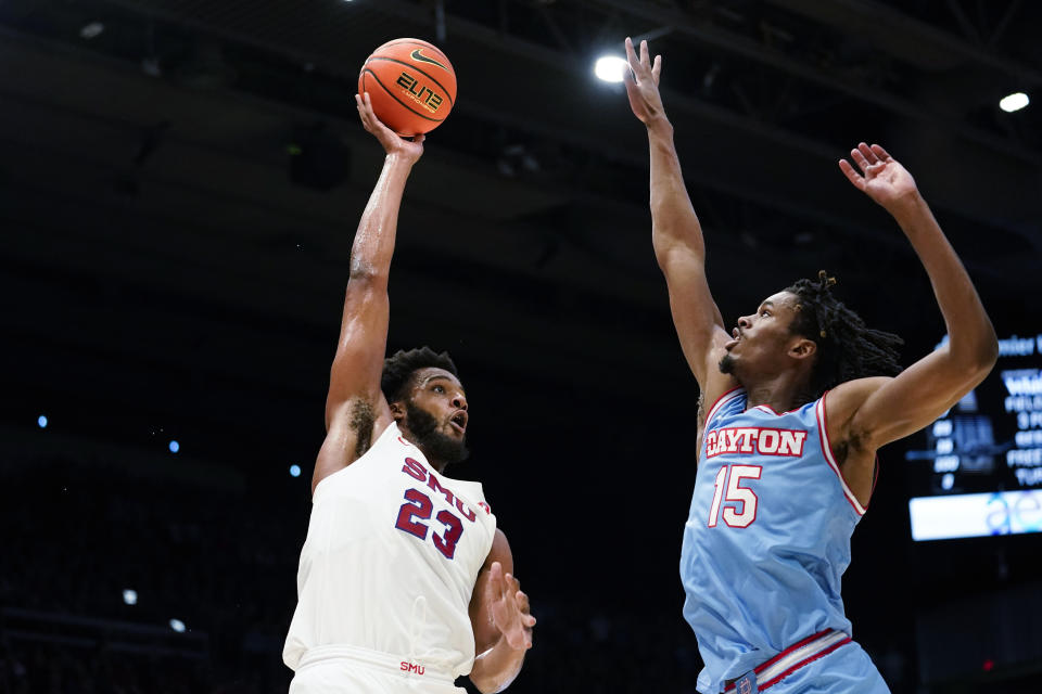 SMU forward Efe Odigie (23) shoots as Dayton forward DaRon Holmes II (15) defends during the first half of an NCAA college basketball game Friday, Nov. 11, 2022, in Dayton, Ohio. (AP Photo/Joshua A. Bickel)