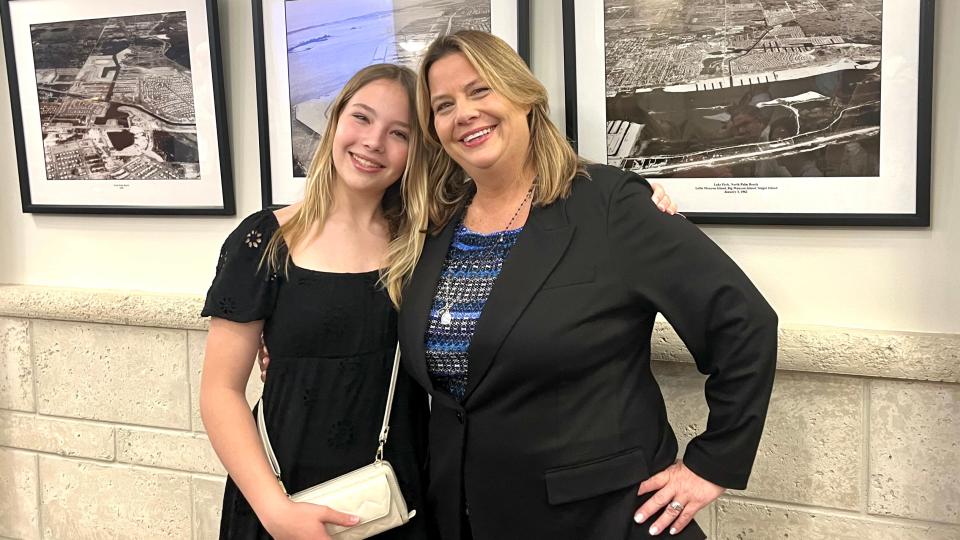 Council Member Lisa Interlandi poses with her daughter, Lia, before the council meeting on March 14, 2024, in North Palm Beach, which was presided over by the village's first all-women council.