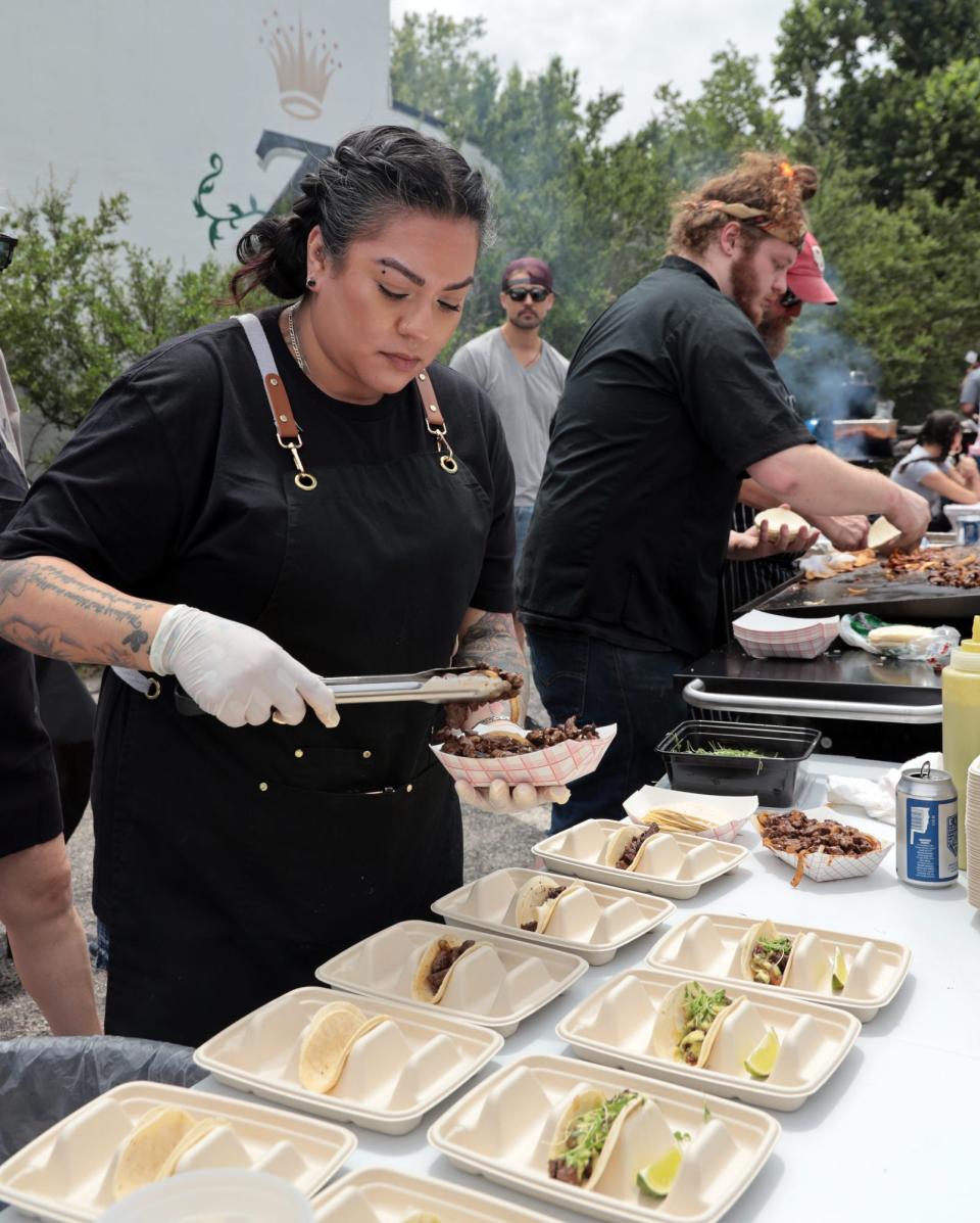 Ashley Gonzalez, executive sous chef at Patron, prepares tacos on June 3 as chefs face off at VZD's in a carne asada taco competition in Oklahoma City.