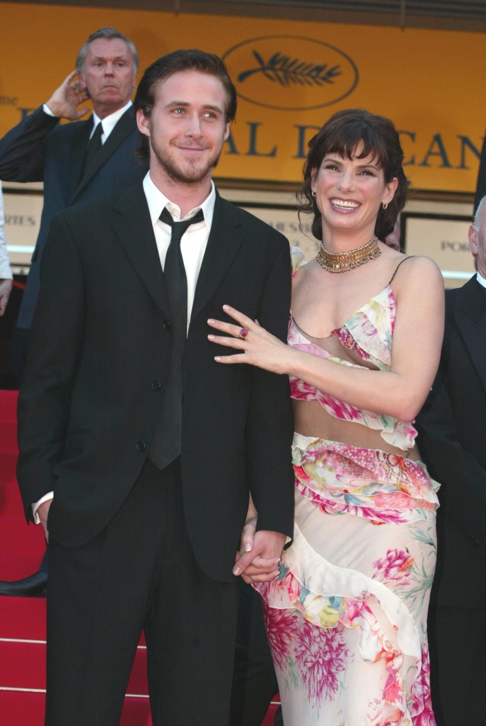 Ryan Gosling and Sandra Bullock holding hands at a 2003 event