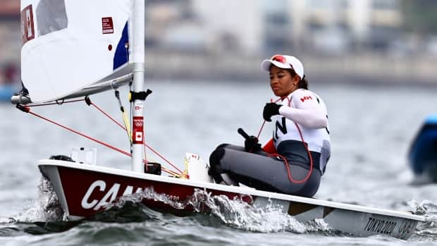 Canada's Sarah Douglas is shown above during qualifying for the laser radial final at the Tokyo Olympics. (Carlos Barria/Reuters - image credit)