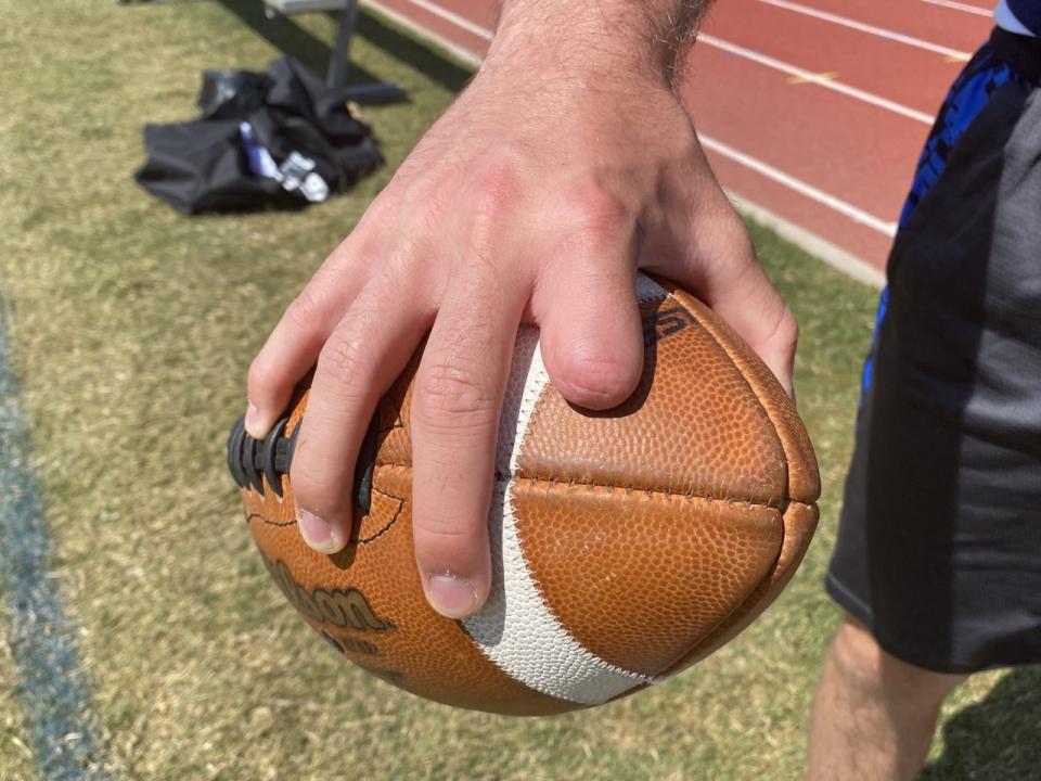 Quarterback Sam Vaulton lost half his index finger while trying to fix an ATV in eighth grade.