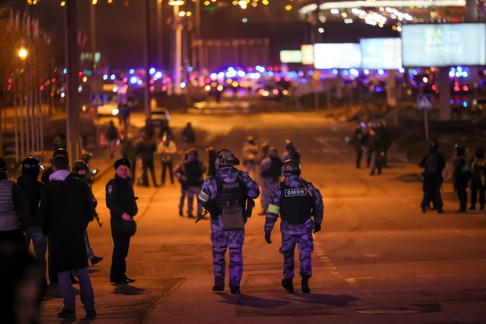 Russian Rosguardia national guard servicemen secure an area near the Crocus City Hall on the western edge of Moscow on March 22, 2024.