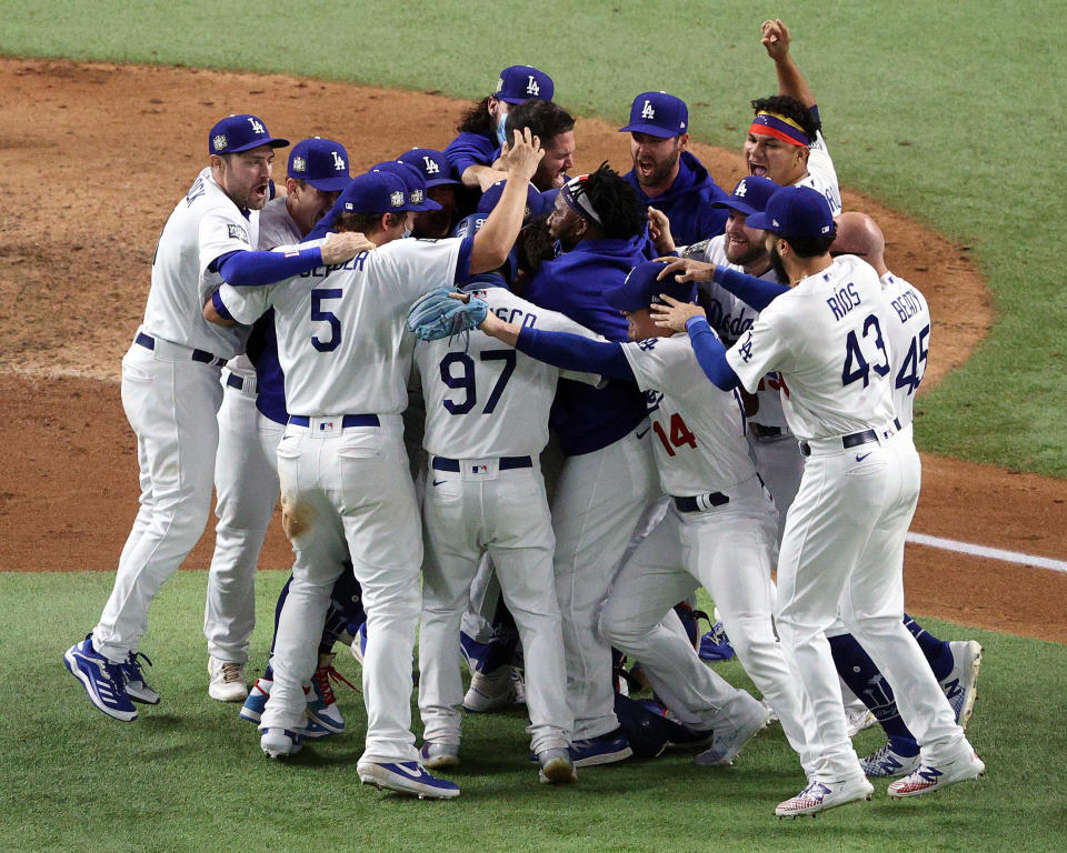 Image: The Los Angeles Dodgers celebrate after defeating the Tampa Bay Rays 3-1 in Game Six to win the 2020 MLB World Series at Globe Life Field (Sean M. Haffey / Getty Images)