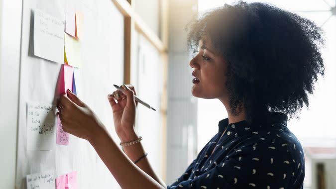 Shot of a young female designer working in her office.