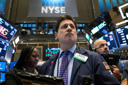 Traders work on the floor at the New York Stock Exchange (NYSE) in New York City, U.S., November 28, 2018. REUTERS/Brendan McDermid