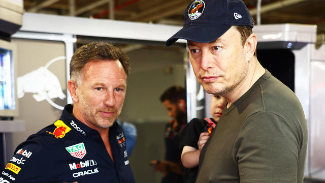 Elon Musk chats with brunette flaunting serious side boob while watching  Miami Grand Prix