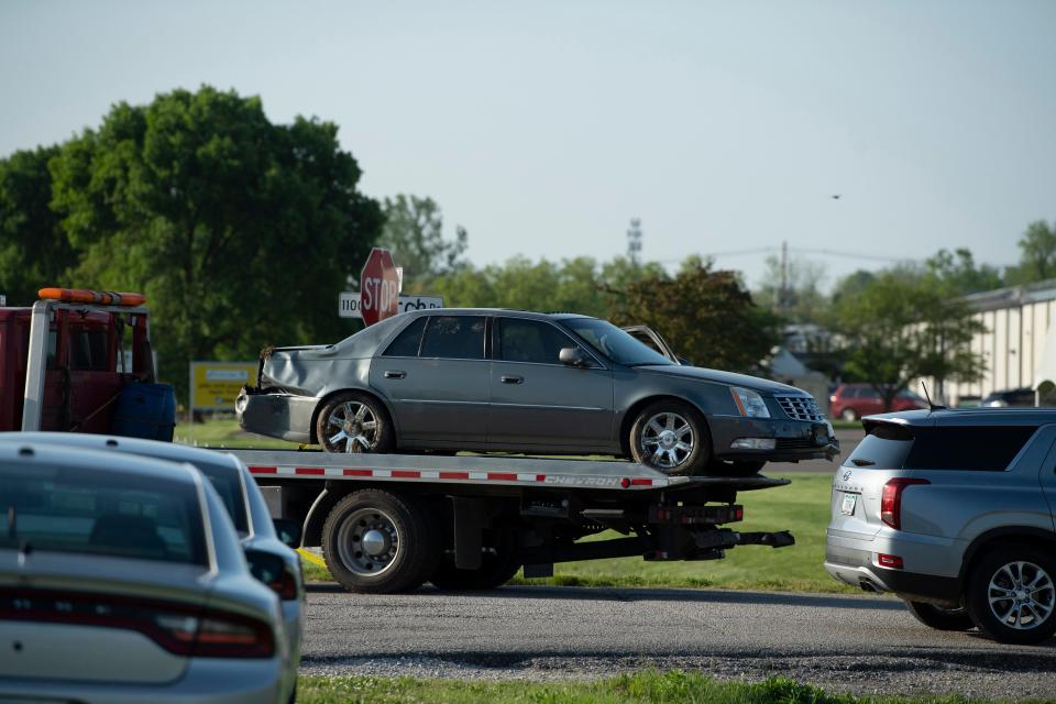 Hamrick's Towing & Recovery hauls the Cadillac sedan fugitives Casey White and Vicky White, no relation, were driving when law enforcement officials forced them into a ditch at Burch Drive in Evansville, Ind., after a short chase Monday evening, May 9, 2022. The two have been on the run since Vicky White, a detention officer, helped the inmate Casey White escape the Lauderdale County Detention Center April 28, 2022.