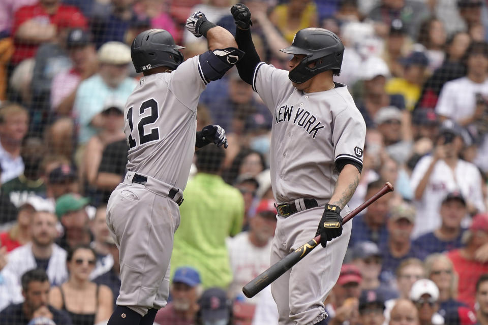 New York Yankees' Rougned Odor, left, celebrates his home run with Gary Sanchez, right, as he arrives a home plate in the sixth inning of a baseball game against the Boston Red Sox, Sunday, July 25, 2021, in Boston. (AP Photo/Steven Senne)