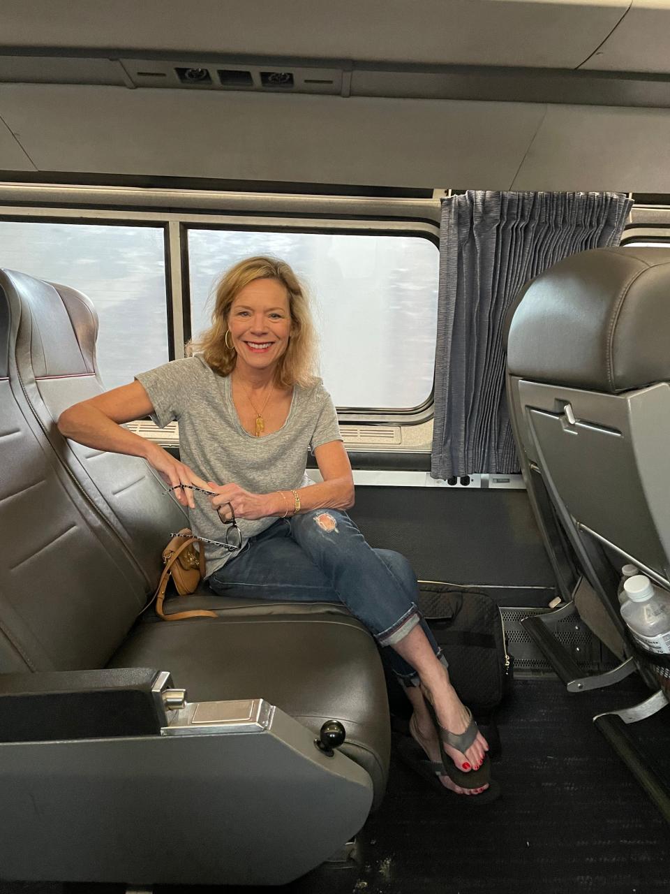 Jenny Lynn Anderson seated on her Amtrak train to Orlando.