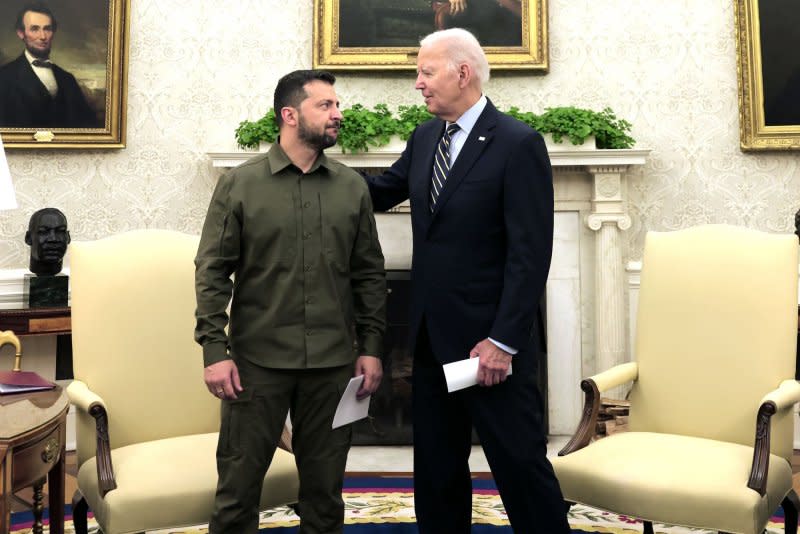 U.S. President Joe Biden (R) and President Volodymyr Zelensky of Ukraine greet each other as they hold a meeting in the Oval Office of the White House on September 21. File Photo by Julia Nikhinson/UPI