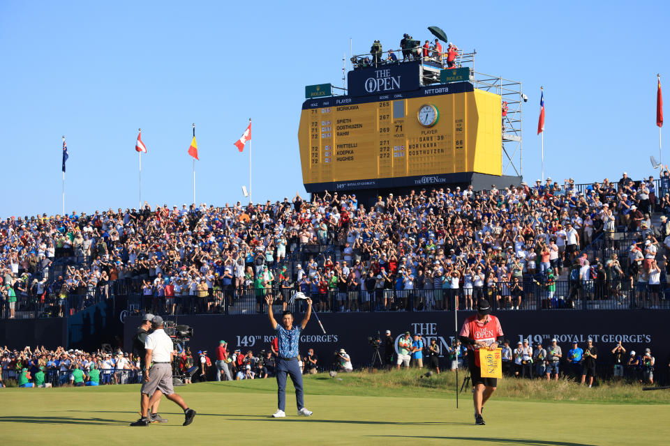 SANDWICH, ENGLAND - JULY 18: Collin Morikawa of the United States celebrates after his putt on the 18th hole as fans applaud during Day Four of The 149th Open at Royal St George’s Golf Club on July 18, 2021 in Sandwich, England. (Photo by Andrew Redington/Getty Images)