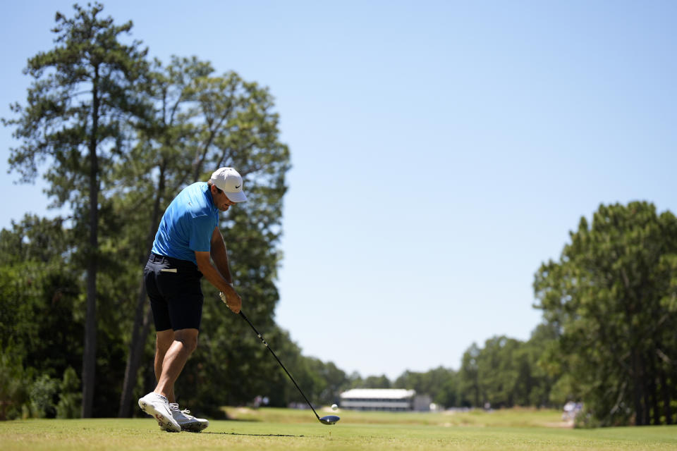 Scottie Scheffler hits his tee shot on the 10th hole during a practice round for the U.S. Open golf tournament Tuesday, June 11, 2024, in Pinehurst, N.C. (AP Photo/Mike Stewart)