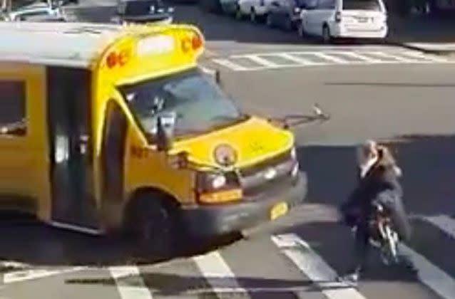 A New York woman is lucky to be alive after being struck by a school bus trying to cross the street. Picture: NYC Scanner/Twitter