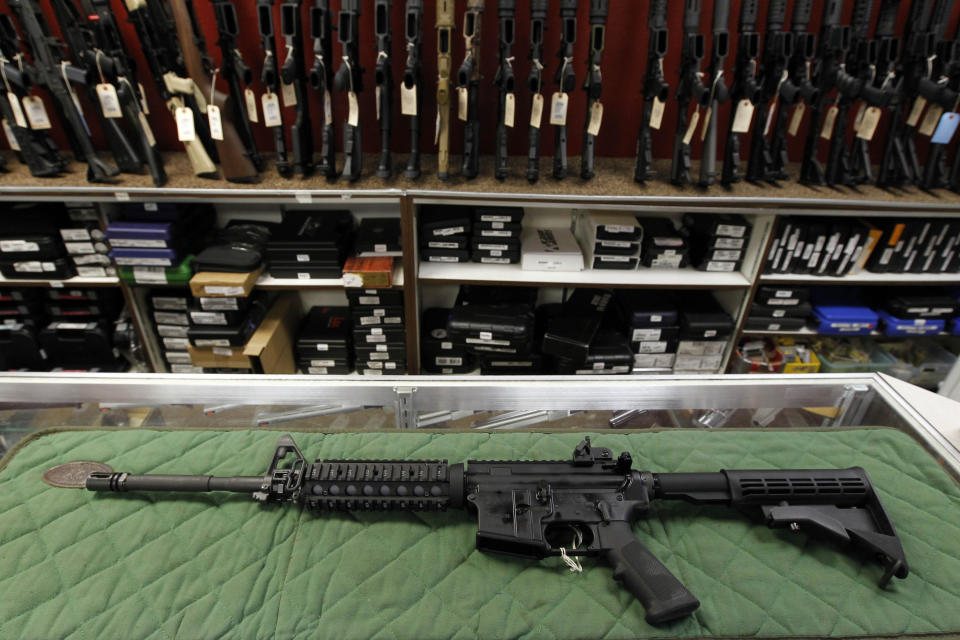 FILE - In this Thursday, July 26, 2012 file photo, an AR-15 style rifle is displayed at the Firing-Line indoor range and gun shop, in Aurora, Colo. A new poll shows a majority of Americans favor stricter gun laws, and most believe schools and places of worship have become less safe over the last two decades, according to a poll conducted by The Associated Press-NORC Center for Public Affairs Research both before and after last week’s mass shooting at two mosques in New Zealand. (AP Photo/Alex Brandon, File)