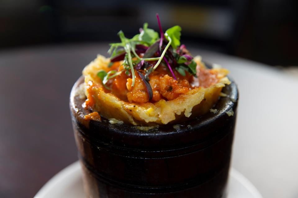 Mofongo rellenos is served in a traditional pilon at Sabor Tropical, 2258 S. Kinnickinnic Ave. The creamy, garlicky mashed green plantain can be filled with seafood or chicken in Creole sauce, or with fried pork.