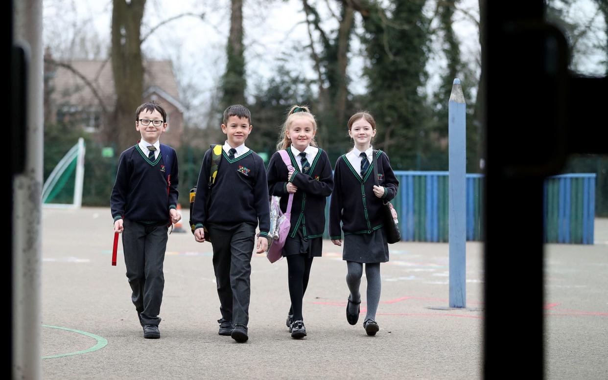 Year 4 children arrive at Manor Park School and Nursery in Knutsford, Cheshire - Martin Rickett /PA