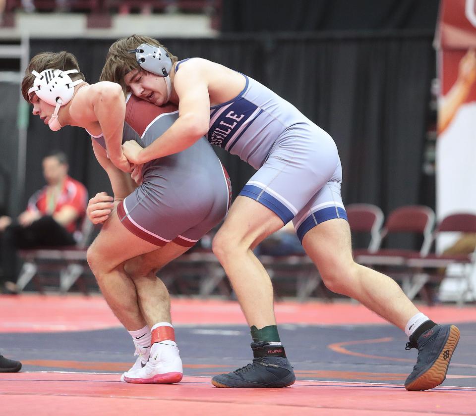 Noah Peterson of Louisville has control of Dover's Brandon Kiser in their 175 pound quarterfinal match at the OHSAA State Tournament in Columbus Saturday.