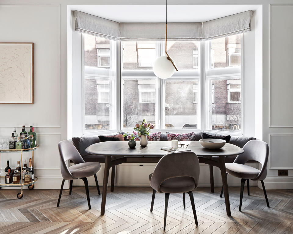 Build a dining area into a bay window to maximize space