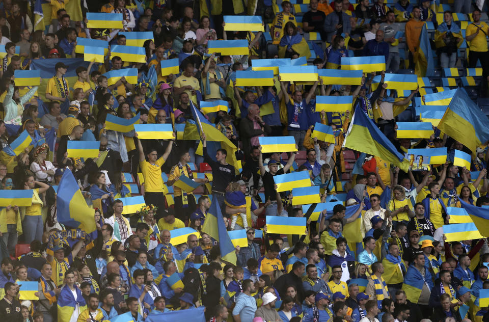 Ukrainian fans support their team before the World Cup 2022 qualifying play-off soccer match between Scotland and Ukraine at Hampden Park stadium in Glasgow, Scotland, Wednesday, June 1, 2022. (AP Photo/Scott Heppell)