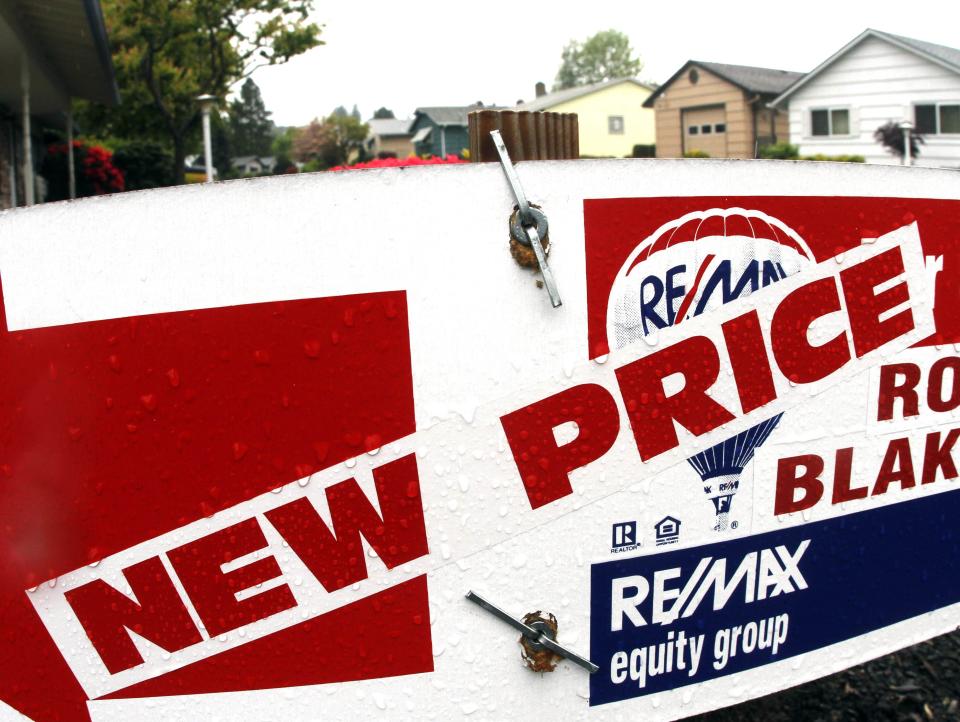 A home sale sign indicating a new price is seen here in King City, Ore., Tuesday, May, 31, 2011. U.S. single-family homes prices dropped into double-dip territory in March as the housing market remained bogged down by inventory and weak demand according to the S&P/Case Schiller composite index. Latest data shows home prices have reached their lowest prices since the housing bubble burst in 2006.(AP Photo/Don Ryan)