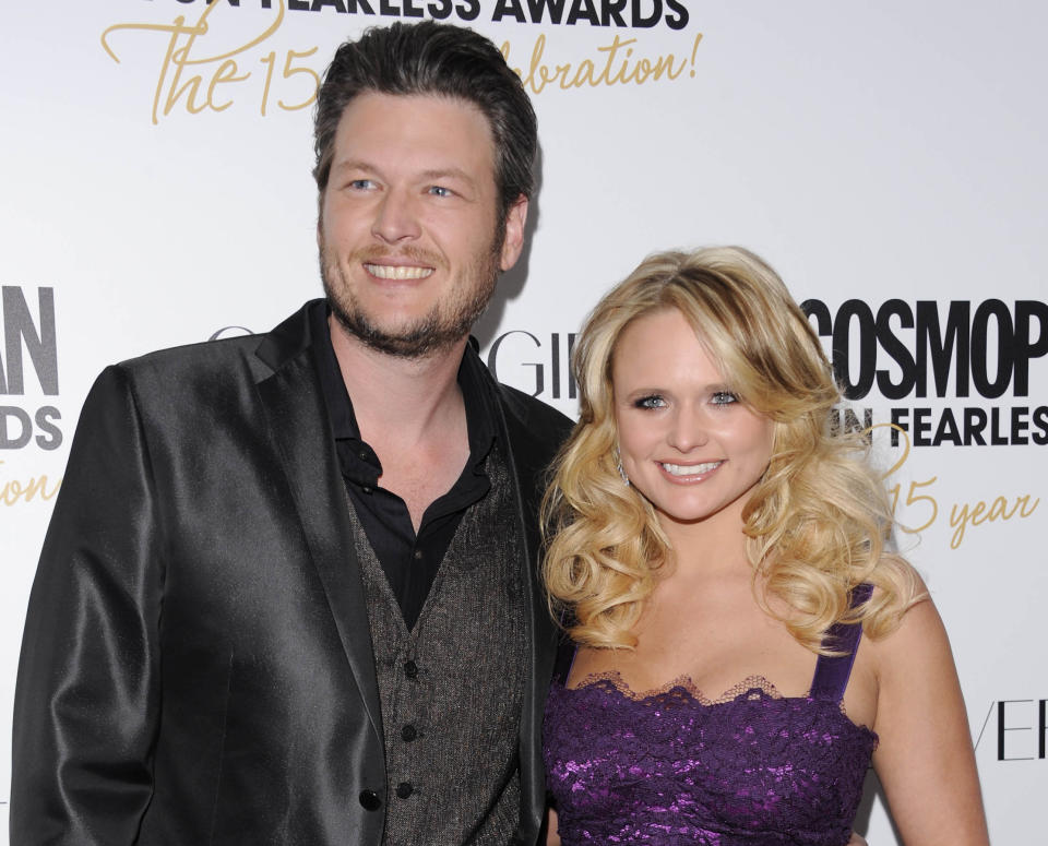 FILE - This March 5, 2012 file photo shows country singers Blake Shelton, left, and his wife, Miranda Lambert at Cosmopolitan Magazine's "Fun Fearless Males and Females of 2012" awards in New York. The couple will attend CMA Music Fest, a four-day opportunity to interact with fans. Lambert performs a set that will include “Over You” and a song with her Pistol Annies trio on Thursday and Shelton is part of Friday's lineup. (AP Photo/Evan Agostini, file)