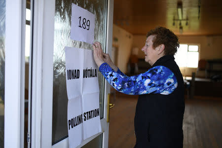 Presiding Officer Carmel McBride prepares the polling station for the referendum on liberalising abortion law a day early for the few people that live off the coast of Donegal on the island of Inishbofin, Ireland May 24, 2018. REUTERS/Clodagh Kilcoyne