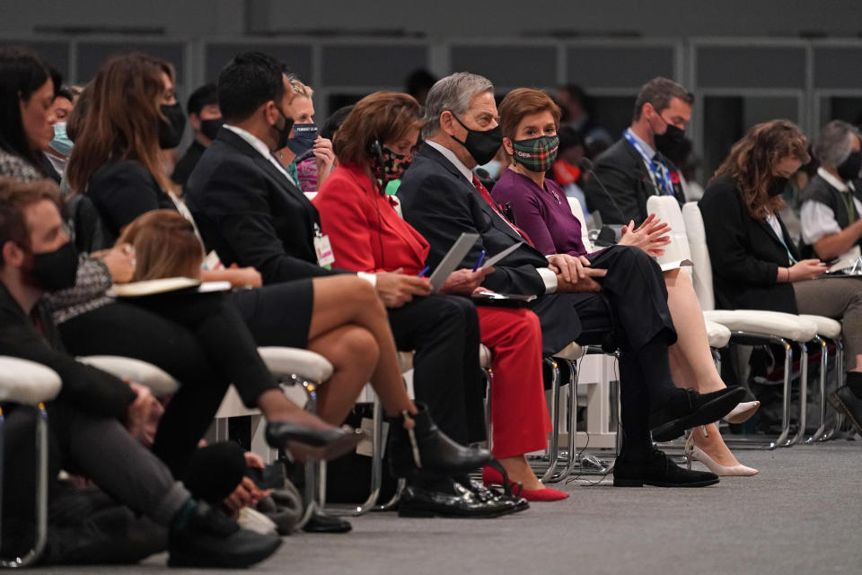 Scotland's first minister Nicola Sturgeon, former British Prime Minister Tony Blair and Speaker of the United States House of Representatives Nancy Pelosi, from third right, attend a session inside the venue of the COP26 U.N. Climate Summit in Glasgow, Scotland, Tuesday, Nov. 9, 2021. The U.N. climate summit in Glasgow has entered it's second week as leaders from around the world, are gathering in Scotland's biggest city, to lay out their vision for addressing the common challenge of global warming. (AP Photo/Alberto Pezzali)