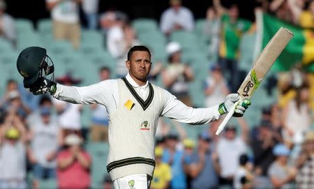 Australian batsman Usman Khawaja celebrates scoring his 100 runs century during the second day of the Third Test cricket match in Adelaide. Australia v South Africa - Third Test cricket match - Adelaide Oval, Adelaide, Australia - 25/11/16. REUTERS/Jason Reed