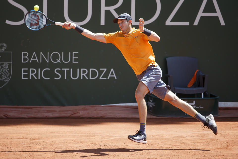 Nicolas Jarry, of Chile, returns a ball to Radu Albot, of Moldova, during their semi final match, at the ATP 250 Geneva Open tournament in Geneva, Switzerland, Friday, May 24, 2019. (Salvatore Di Nolfi/Keystone via AP)