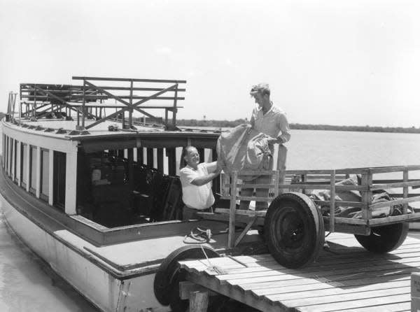 Crew loading mailbags onto the mailboat to Captiva-Sanibel Islands in 1955.