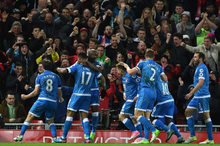 Bournemouth's striker Joshua King (2nd L) celebrates with teammates after scoring their second goal during the English Premier League football match between Liverpool and Bournemouth at Anfield in Liverpool, north west England on April 5, 2017