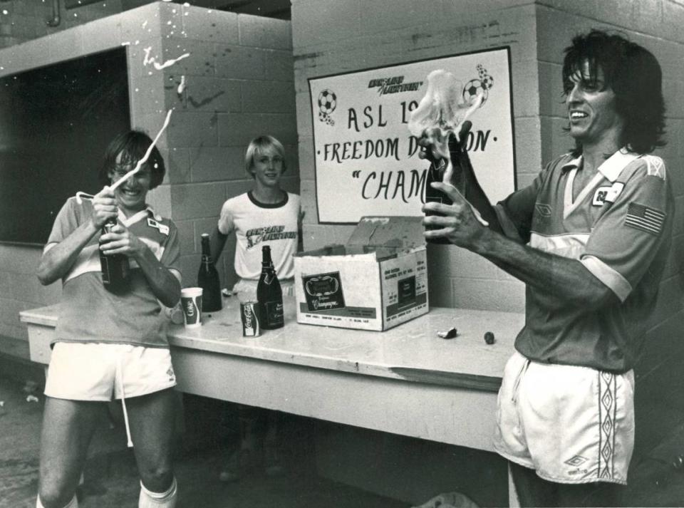 Tony Suarez (right) pops some champagne after a big win for the Carolina Lightnin’ in 1981.