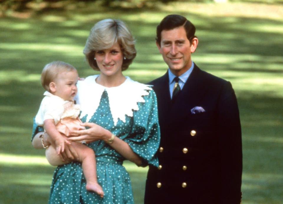 <p>Princess Diana wearing a green dress with white polka dots and a white puritan collar designed by Donald Campbell, poses with Prince Charles and their baby son, Prince William, in the gardens of Government House in Auckland, New Zealand, in April 1983.</p>