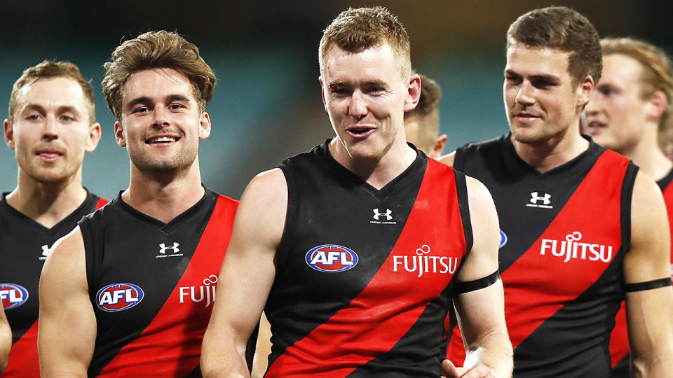 Essendon Bombers players are pictured walking off the field after their round two AFL game.