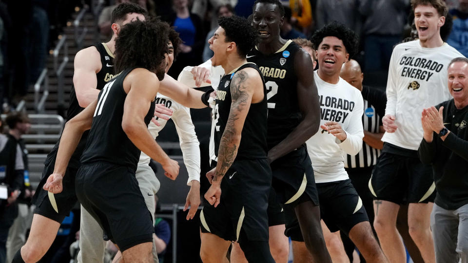 Colorado's KJ Simpson (center) celebrates with his teammates after hitting the game-winning shot to defeat Florida in the first round of the NCAA tournament on Friday in Indianapolis. (Photo by Dylan Buell/Getty Images)
