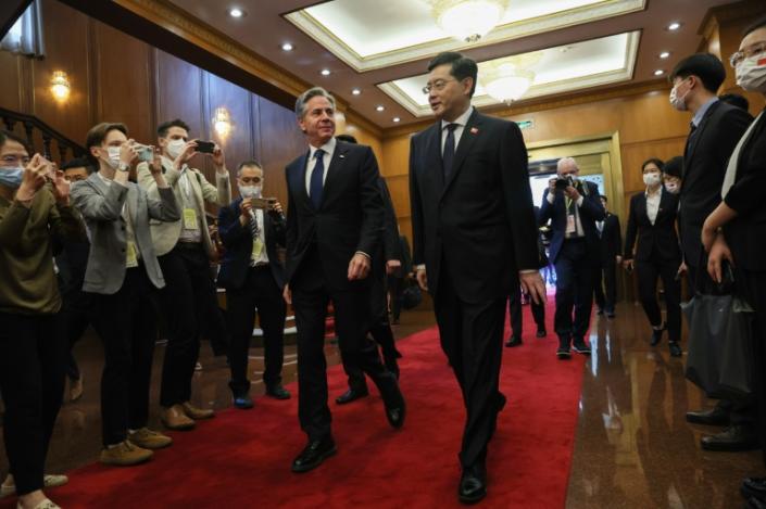 US Secretary of State Antony Blinken (left) walks with Chinese Foreign Minister Qin Gang (right) before a meeting at the Diaoyutai State Guesthouse in Beijing on June 18, 2023. (LEAH MILLIS)