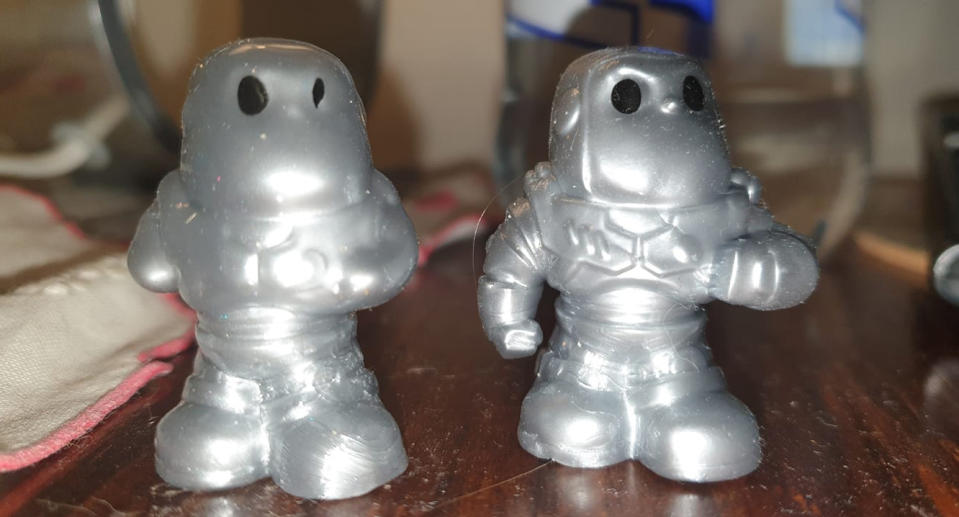 Two Buzz Lightyear Woolworths Ooshies are pictured, one with a mutant defect. 