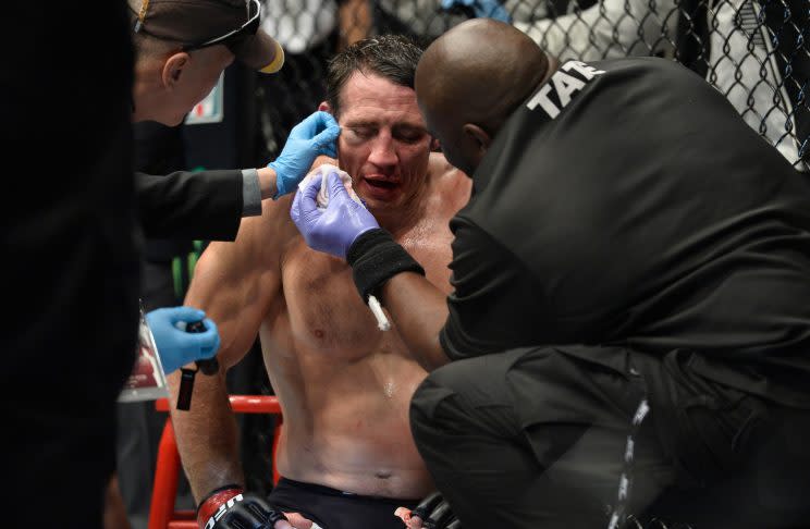 Tim Kennedy, being tended to at UFC 206 after being stopped by Kelvin Gastelum, announced his retirement on Tuesday. (Brandon Magnus/Getty Images)