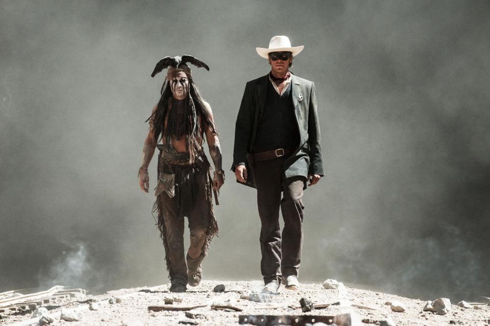 This undated publicity photo released by Disney and Jerry Bruckheimer, Inc. shows Johnny Depp, left, as Tonto, and Armie Hammer, as The Lone Ranger, in a scene from the film, "The Lone Ranger." (AP Photo/Disney/Jerry Bruckheimer, Inc., Peter Mountain, File)