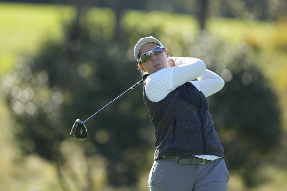 Ashleigh Buhai of South Africa watches her tee shot on the second hole during the third round of the BMW Ladies Championship at the Seowon Hills Country Club in Paju, South Korea, Saturday, Oct. 21, 2023. (AP Photo/Lee Jin-man)
