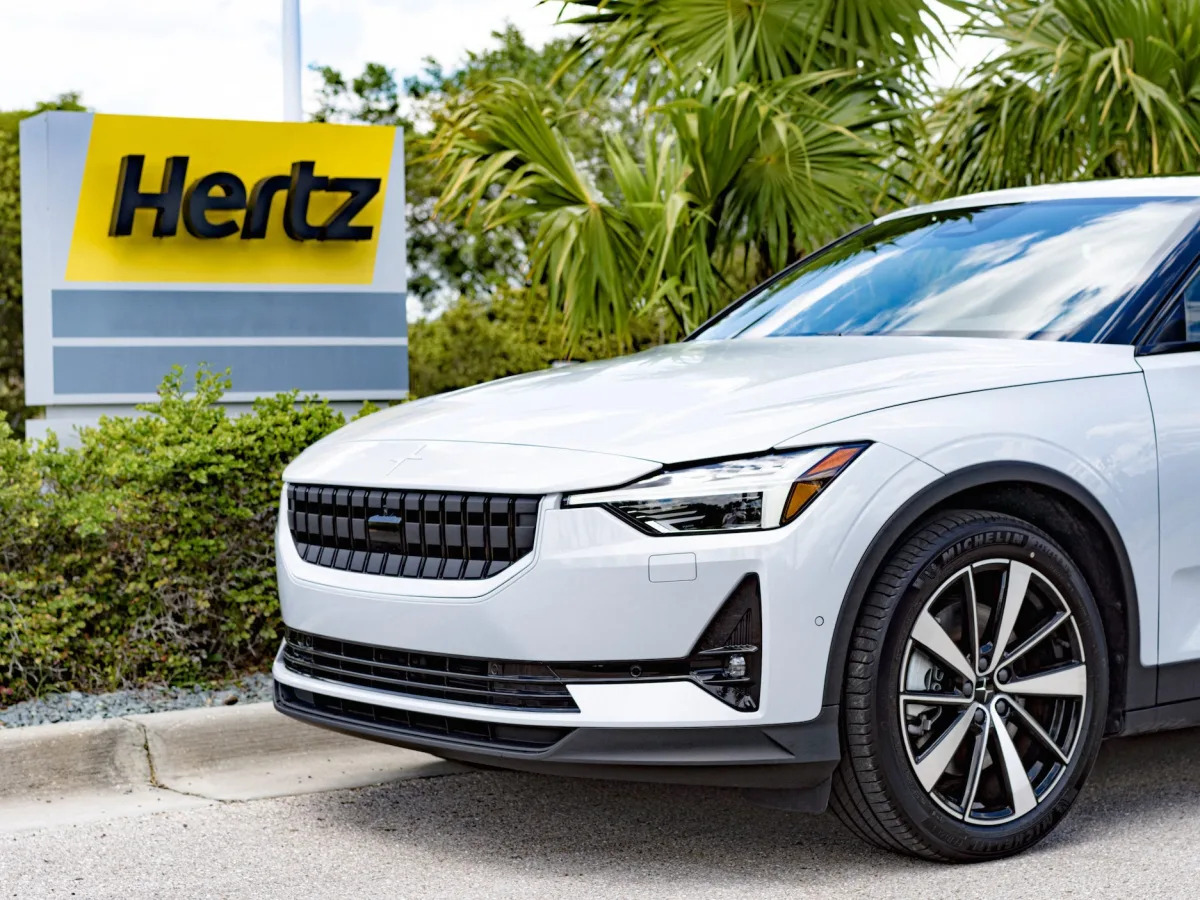 A man is suing Hertz because his rental car was stopped by armed police after be..