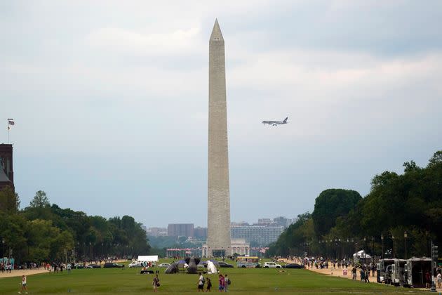 Trump's airplane flies behind the Washington Monument as it makes its final approach into Ronald Reagan Washington National Airport.