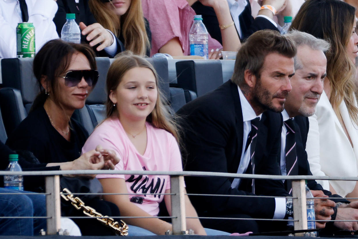 (L-R) Victoria Beckham, Harper Beckham and David Beckham. (Photo: Cliff Hawkins/Getty Images)