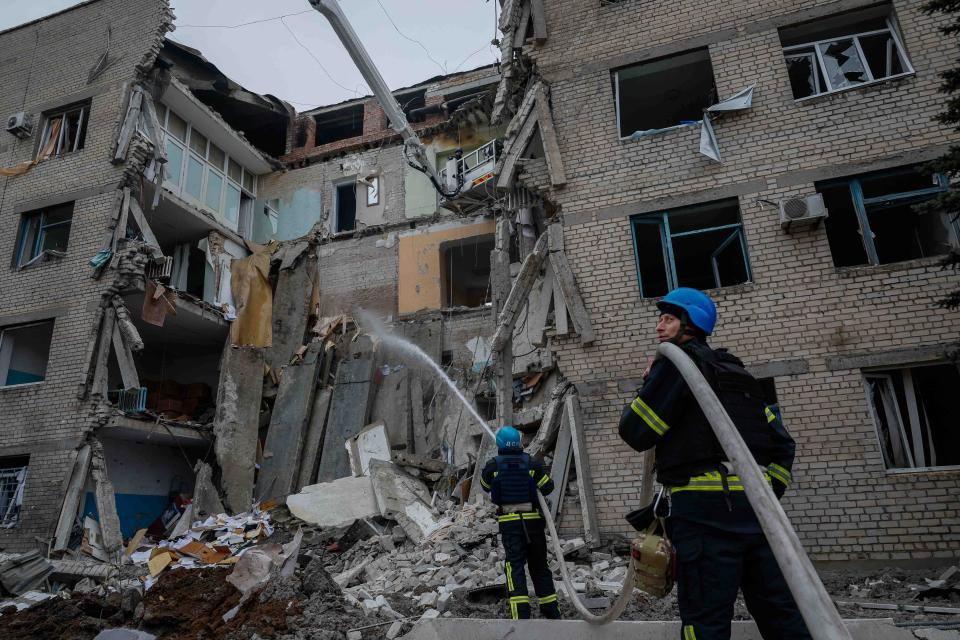 Rescuers work on the side of a hospital which was heavily damaged by a Russian missile strike in eastern Ukraine this morning (REUTERS)